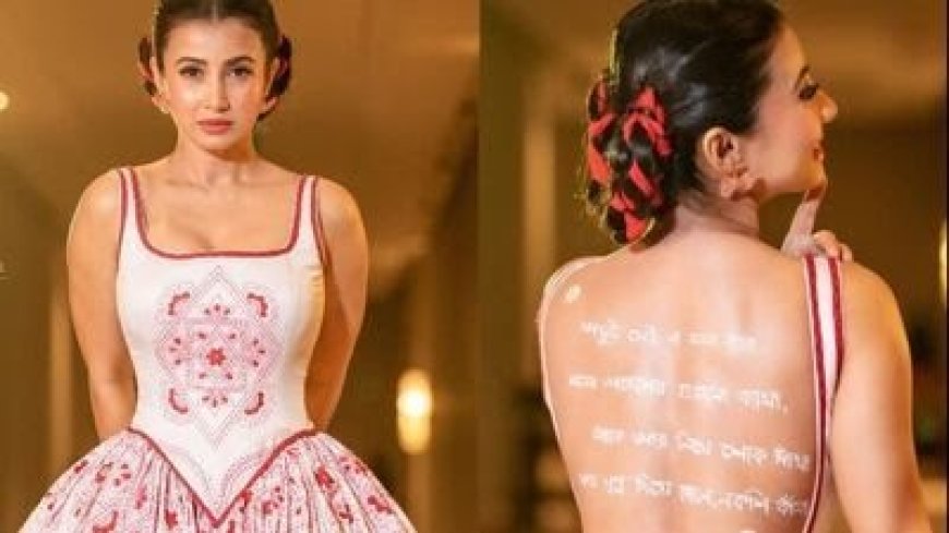 Monami Ghosh: Wrapped in a fusion of East and West, with open back adorned by lines of poetry, she gracefully donned a white-red Kantha embroidered gown